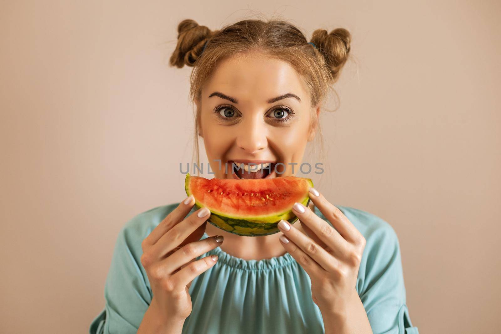 Woman enjoys eating watermelon by Bazdar