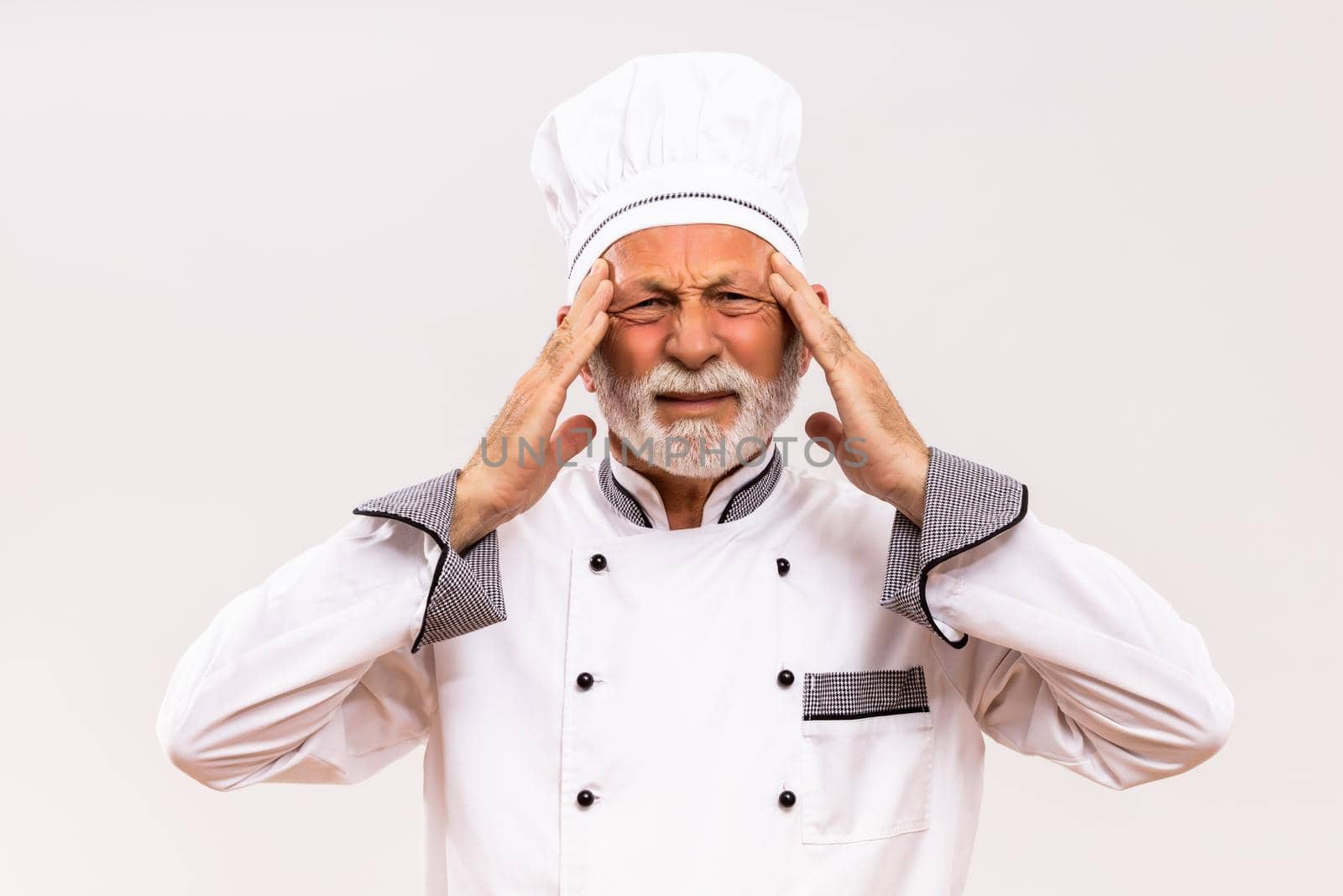 Senior chef having headache by Bazdar
