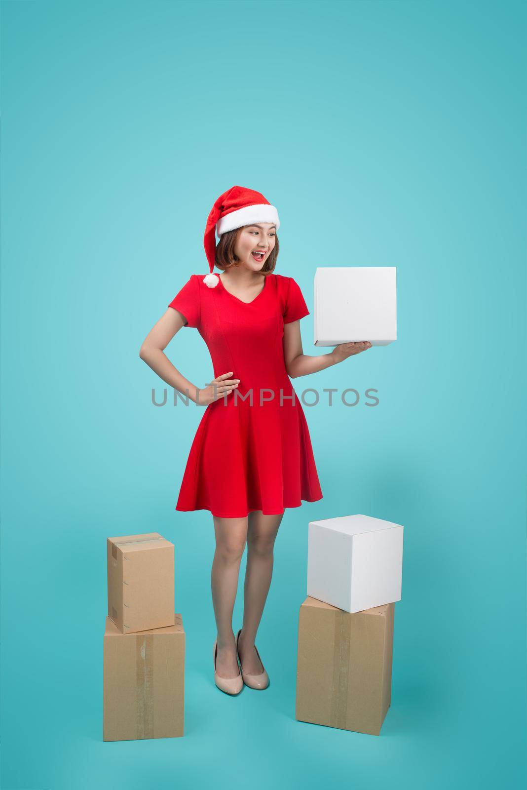 Asian Woman with Christmas Santa hold christmas gift.