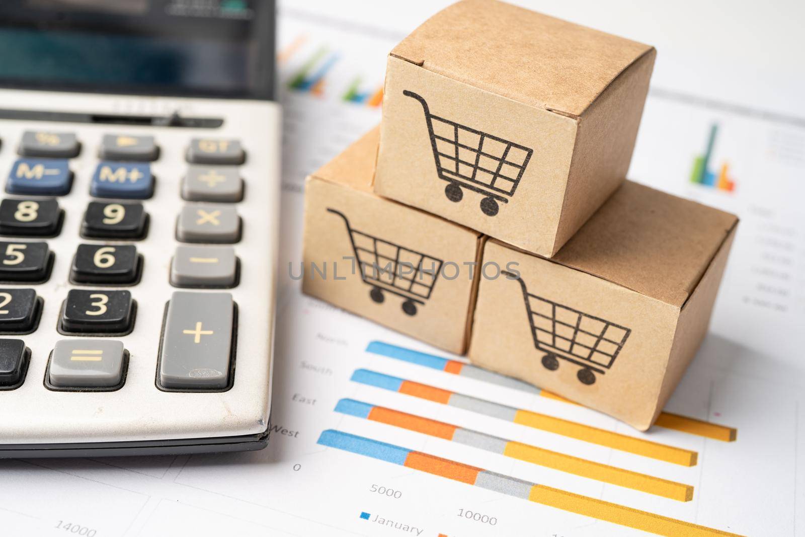 Shopping cart logo on box with magnifying glass on graph background. Banking Account, Investment Analytic research data economy, trading, Business import export transportation online company concept.