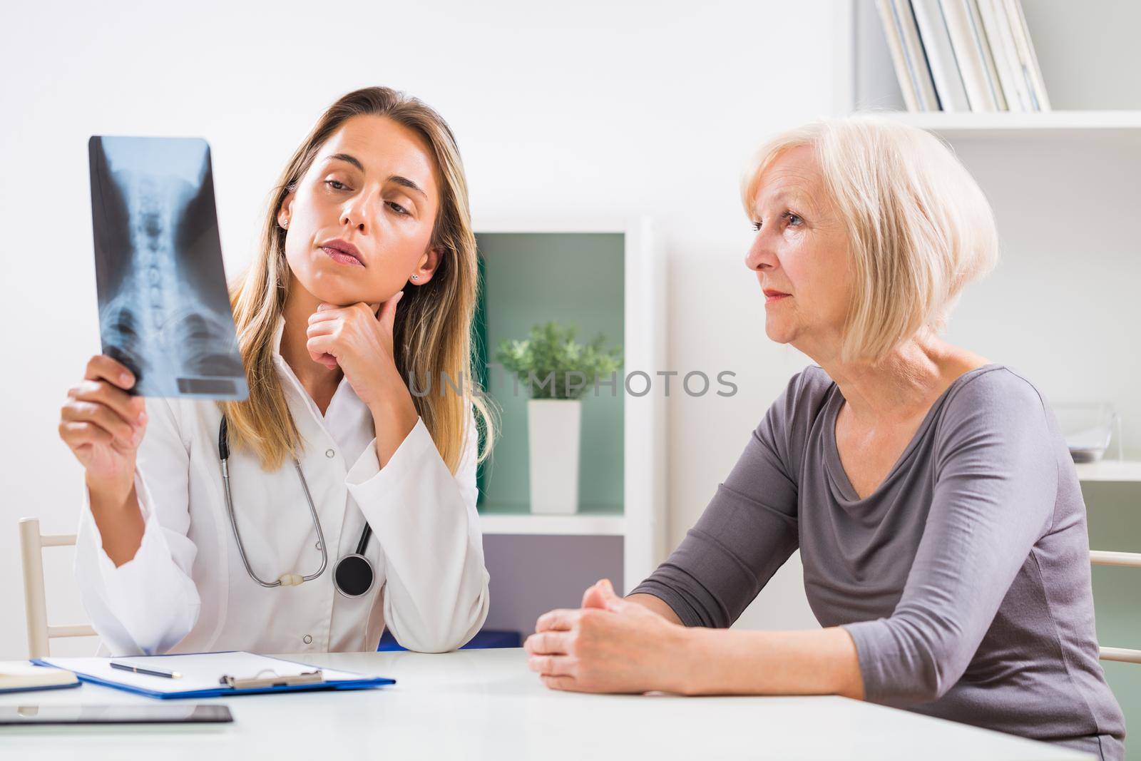 Female doctor and senior woman patient by Bazdar