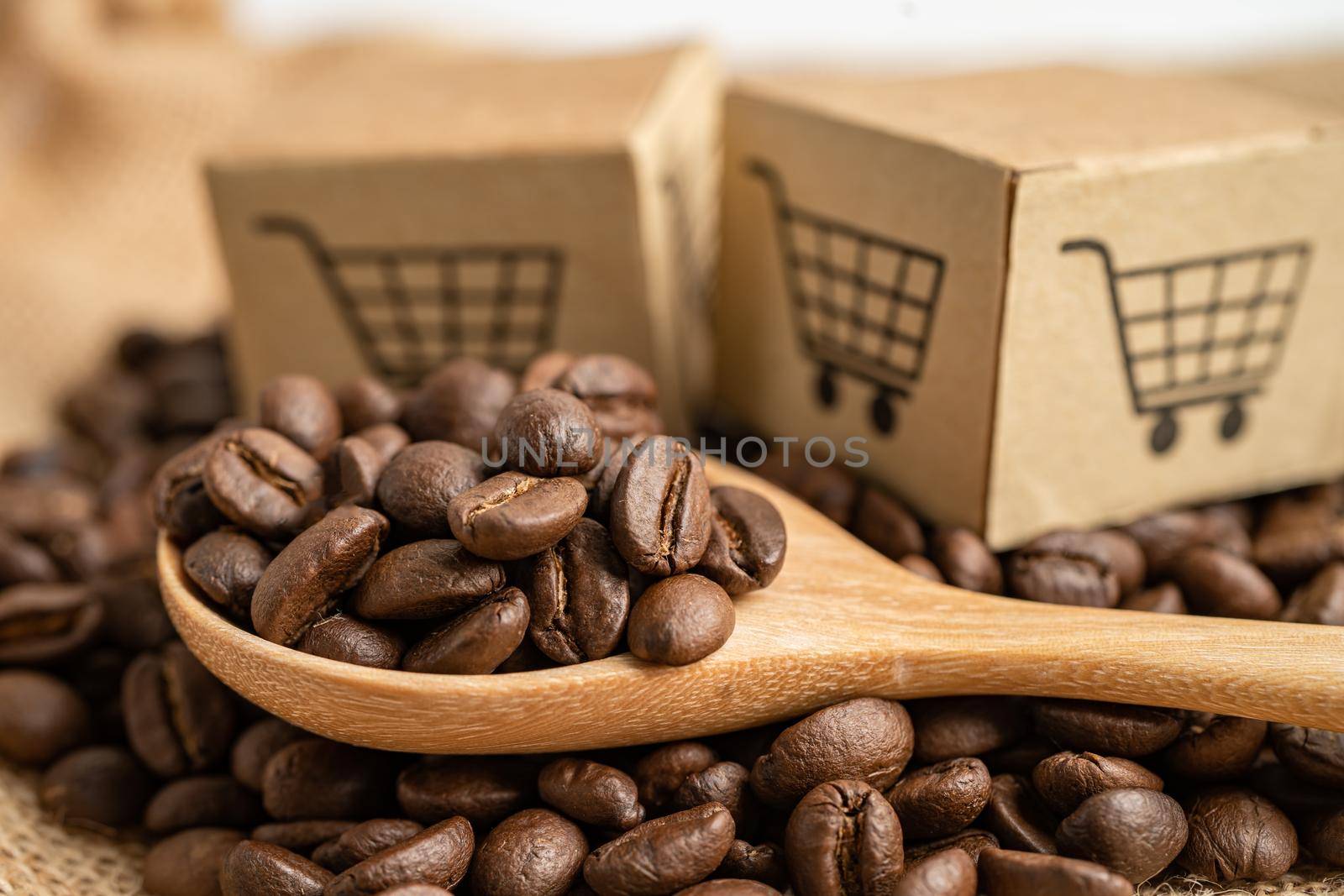 Box with shopping cart logo symbol on coffee beans, Import Export Shopping online or eCommerce delivery service store product shipping, trade, supplier concept.