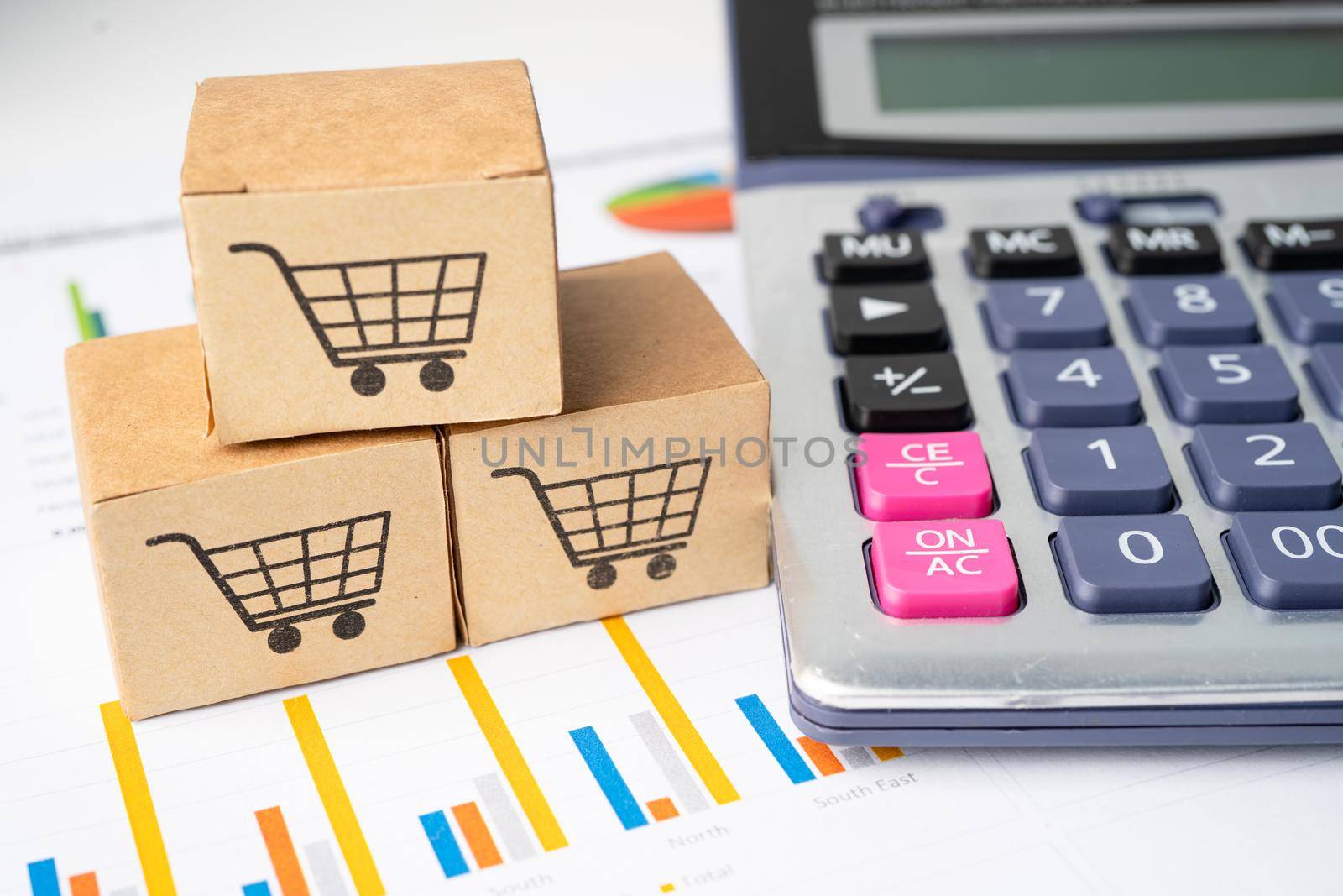 Shopping cart logo on box with magnifying glass on graph background. Banking Account, Investment Analytic research data economy, trading, Business import export transportation online company concept.