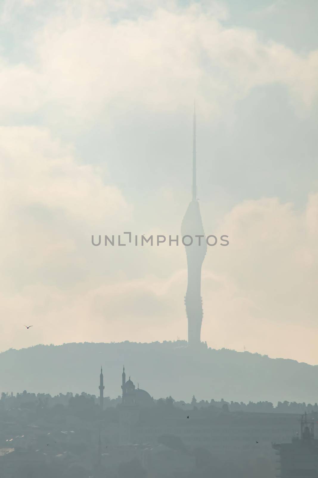 istanbul,turkey-june 29,2021.camlica tv tower and foggy landscape in the morning and istanbul city.