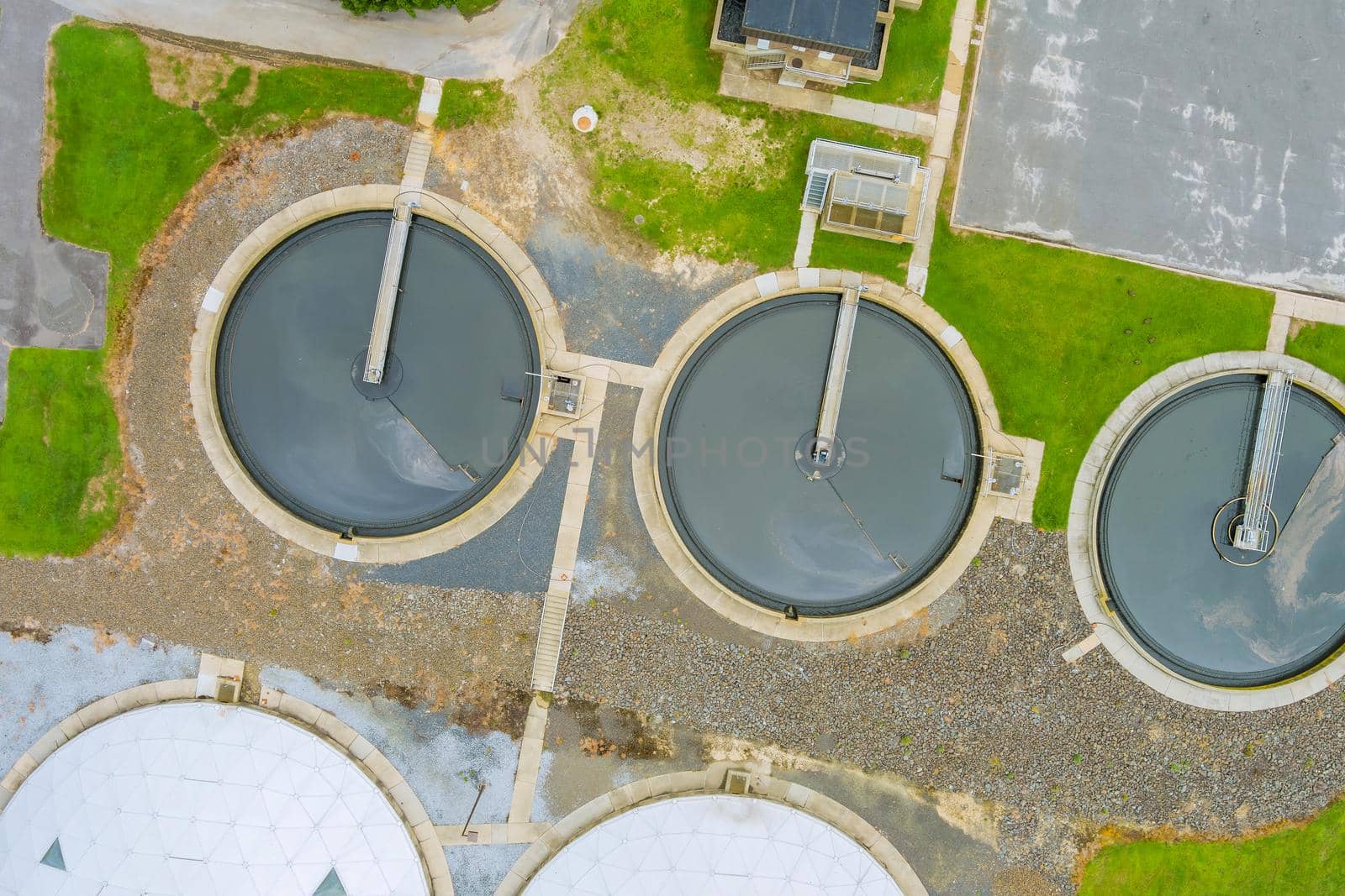 Aerial top view recirculation clarifier sedimentation tank environment water recycling on sewage treatment station by ungvar