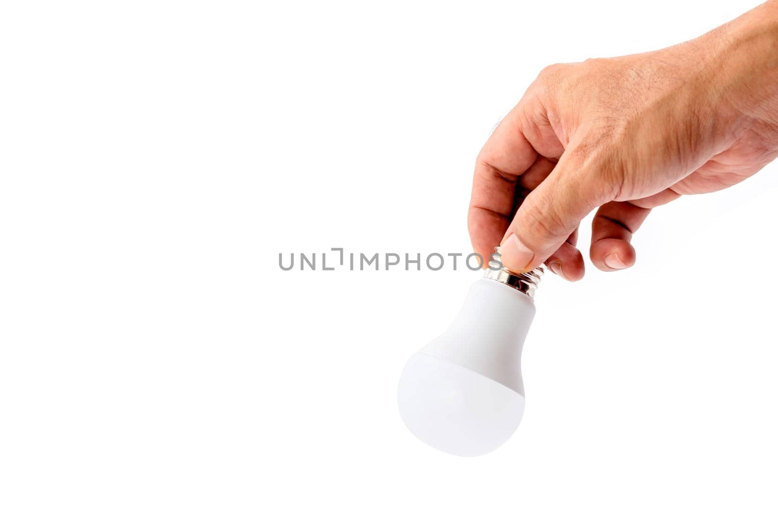 Human hand holding LED light bulb isolated on white background. by wattanaphob