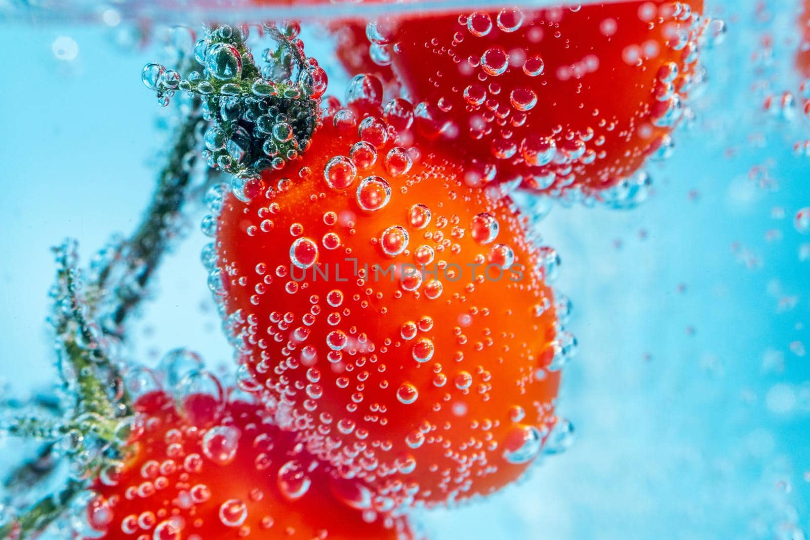 Red bell pepper close-up in the water under the water, selective micro focus