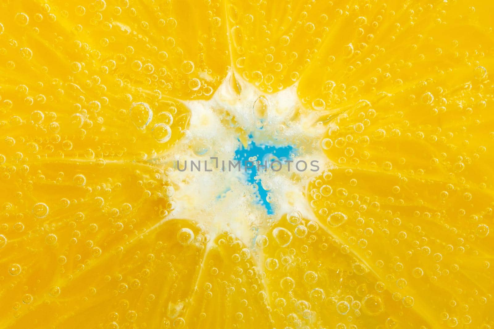 orange fruit in the water close-up macro. Refreshing grapefruit drink, cocktail. Slow motion by darksoul72
