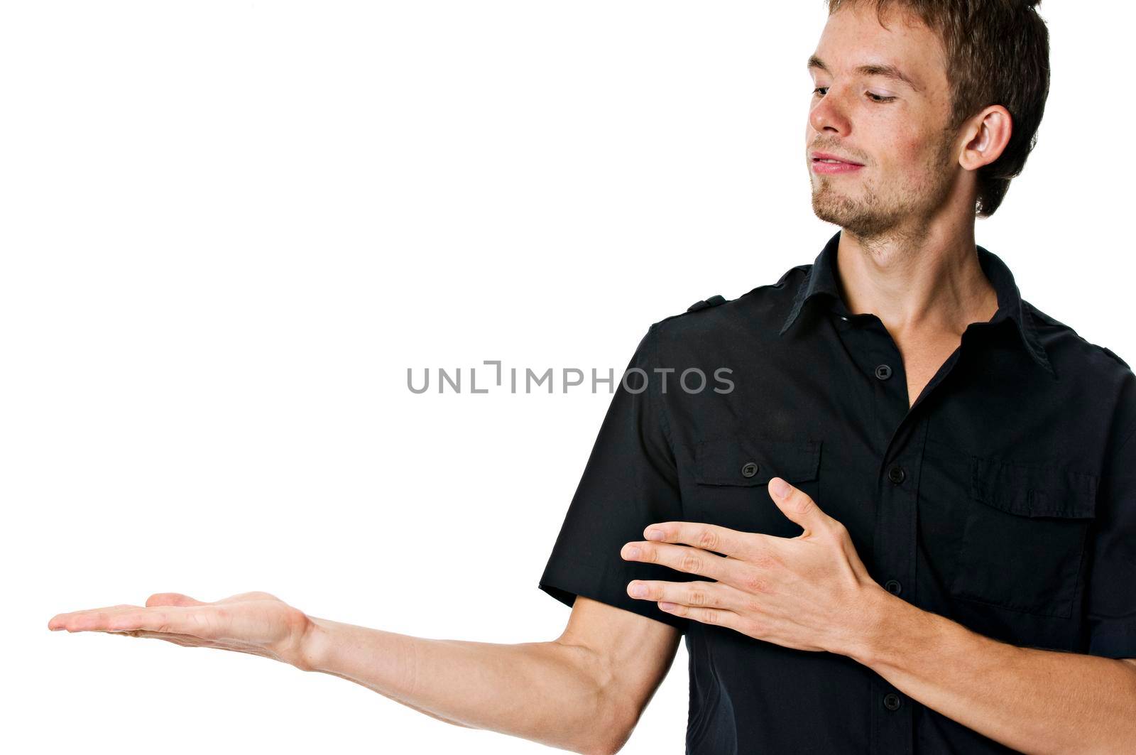 Young man holding anything you want on his hand isolated on white