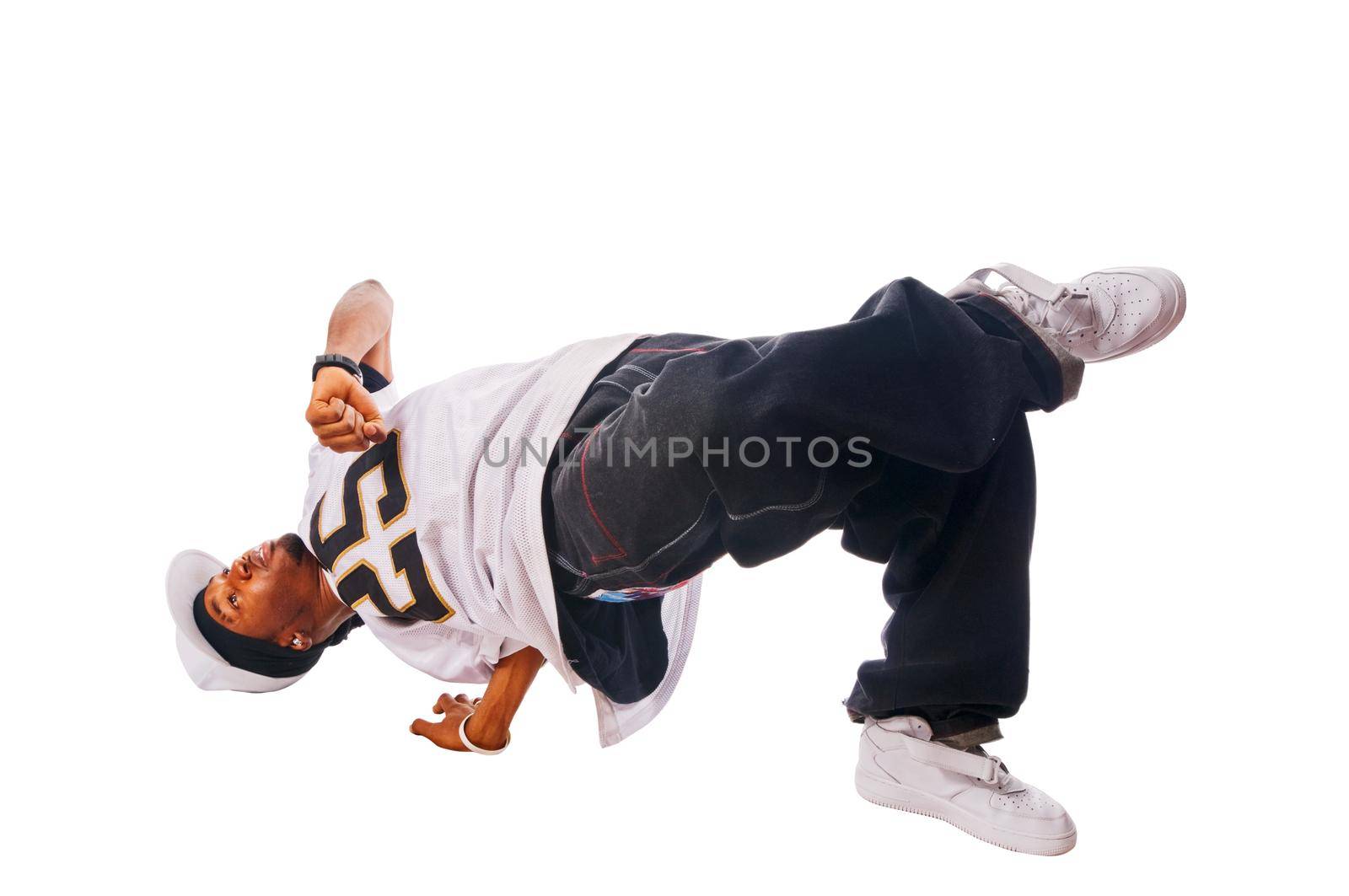 Cool young hip-hop dancer on white background