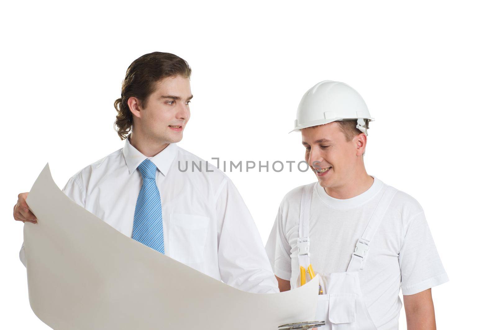 Young engineer and worker discussing large blueprint