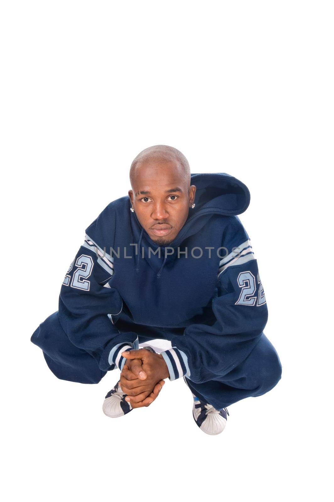 Cool young hip-hop dancer on white background