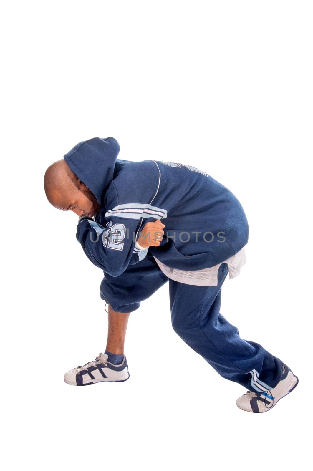 Cool young hip-hop dancer on white background