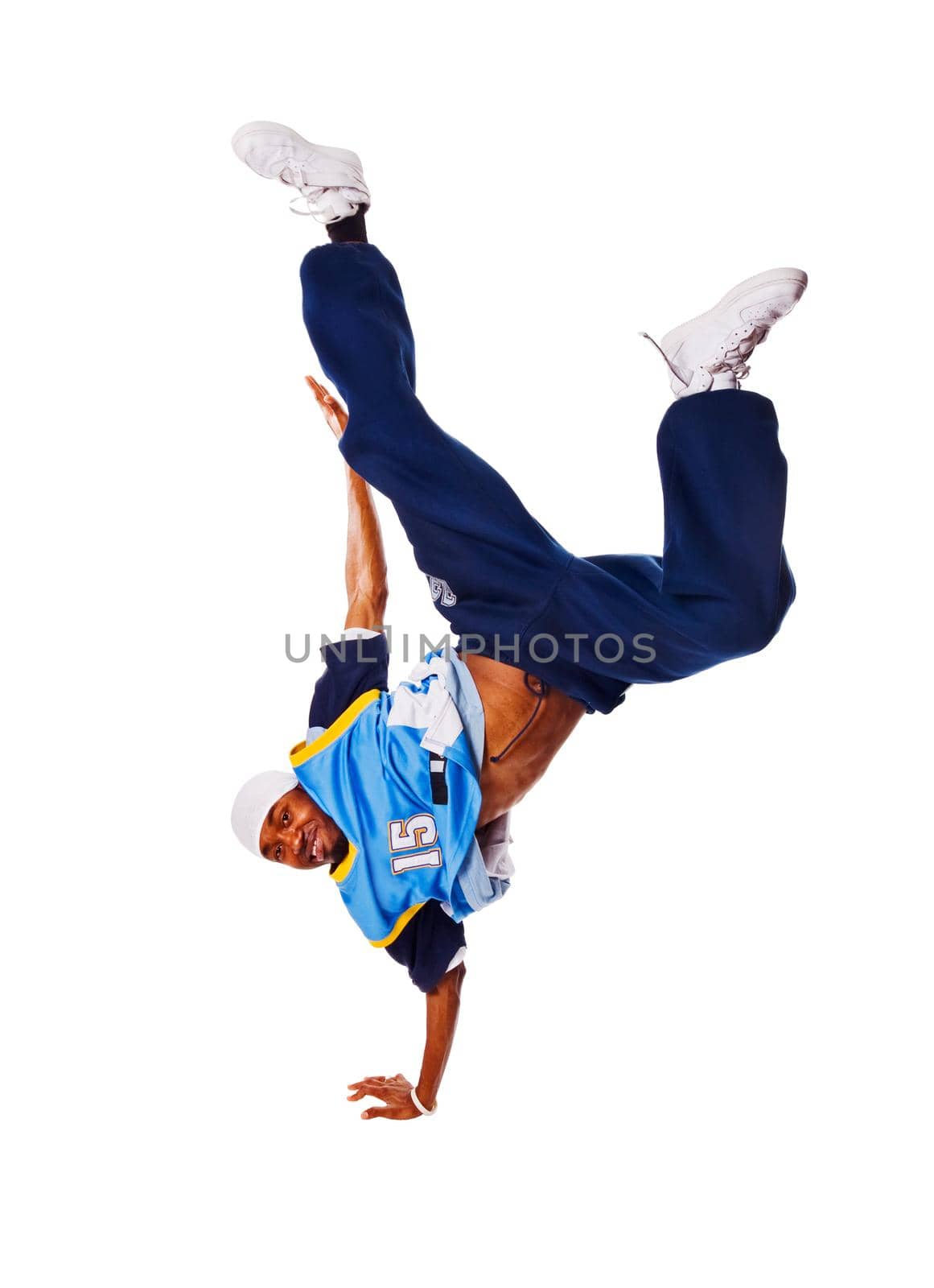 Hip-hop young man making cool move on white background