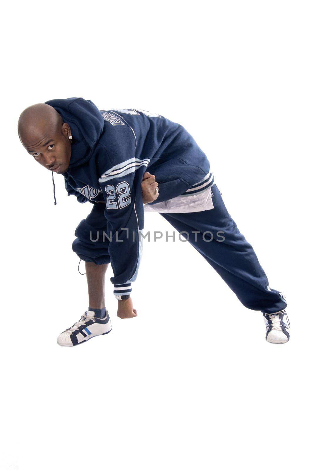 Cool young hip-hop dancer on white background