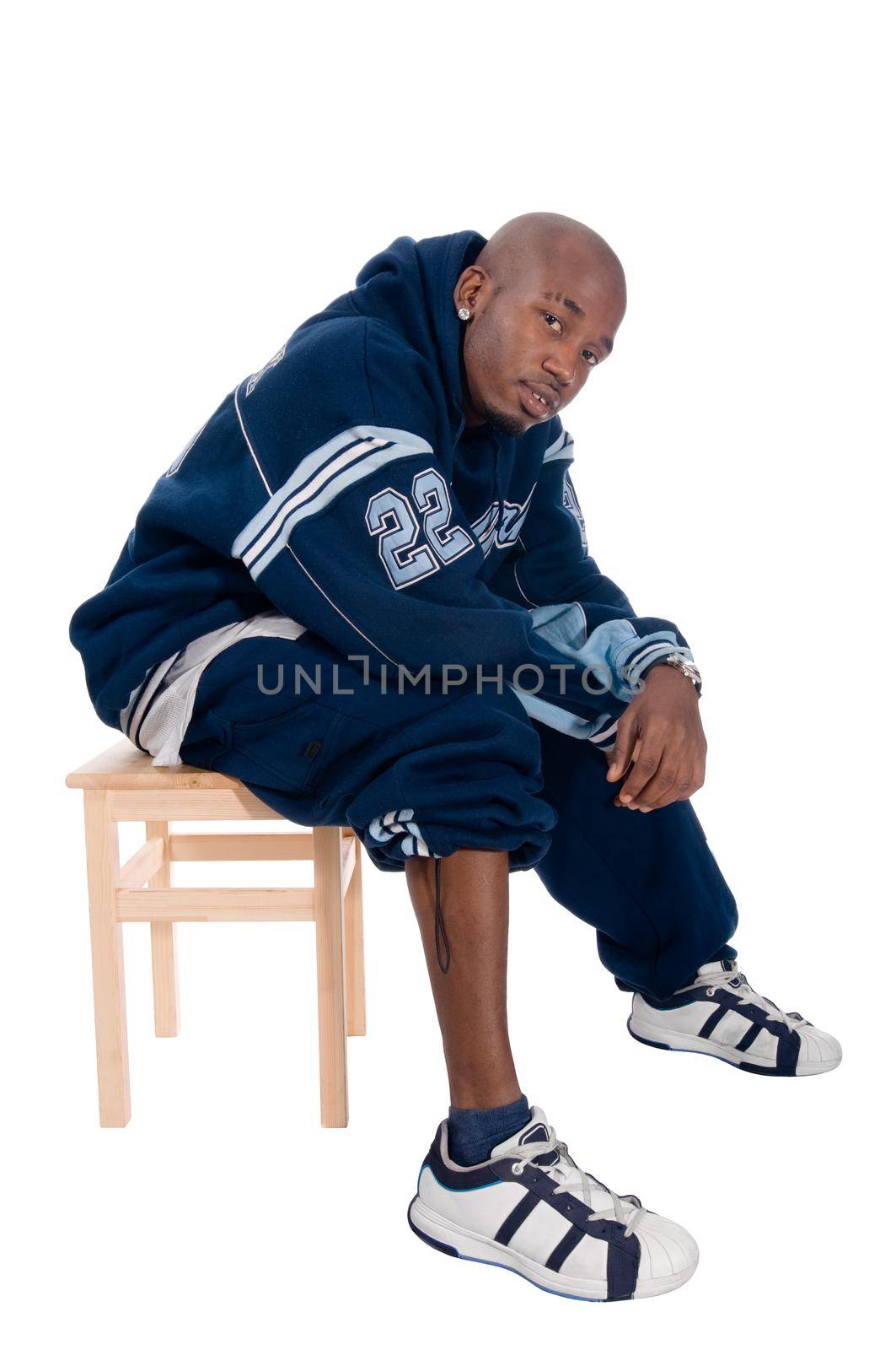 Cool young hip-hop dancer on white background