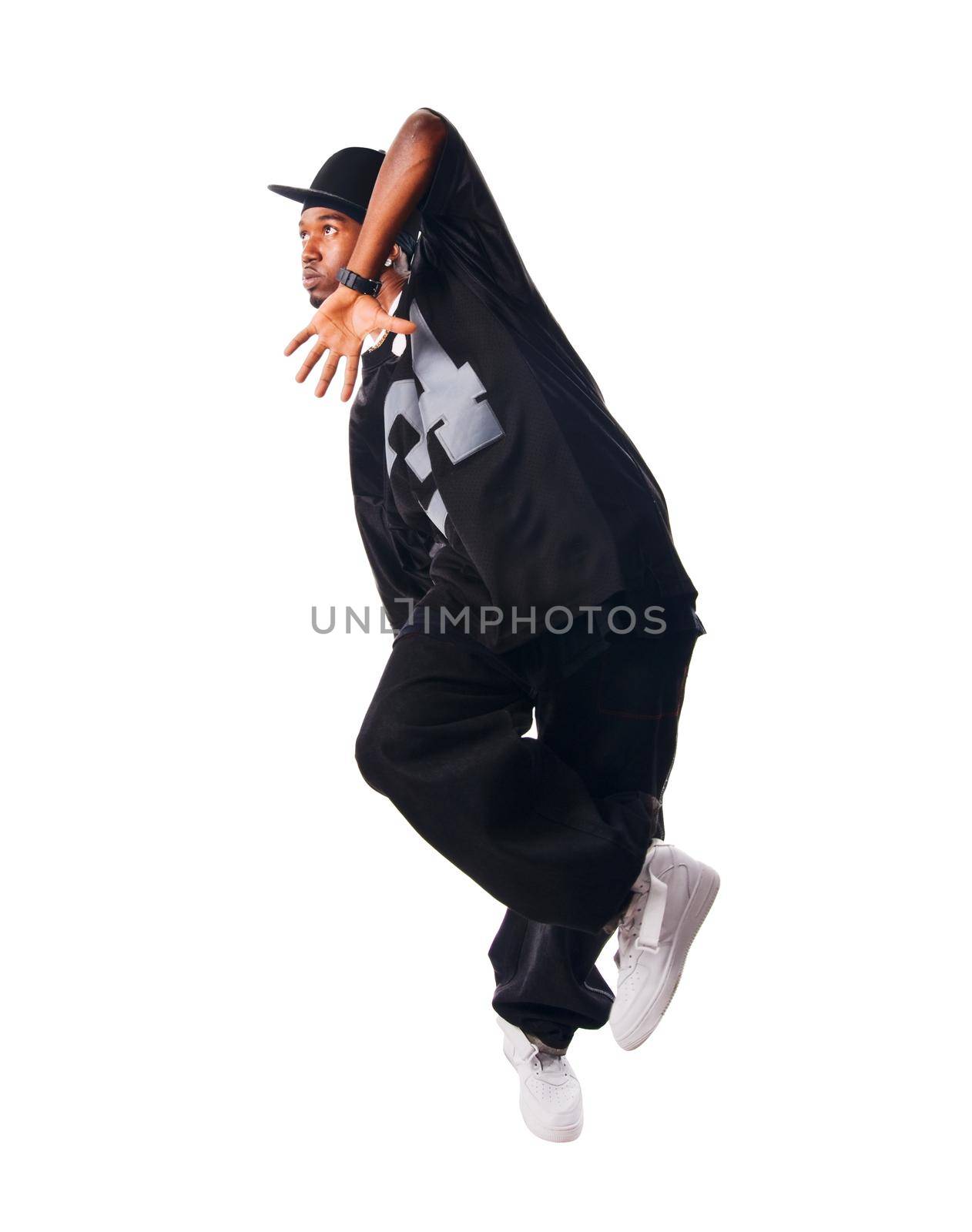 Cool young hip-hop dancer on white background