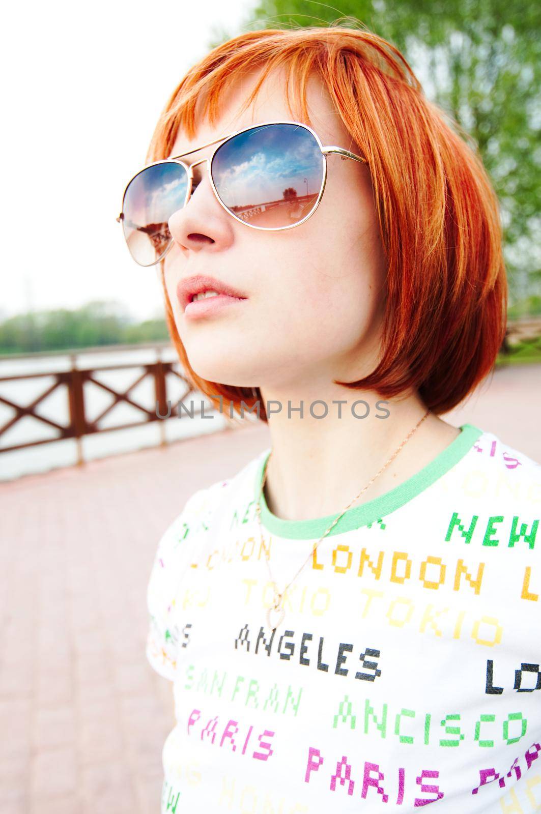 Young woman wearing sunglasses by nikitabuida