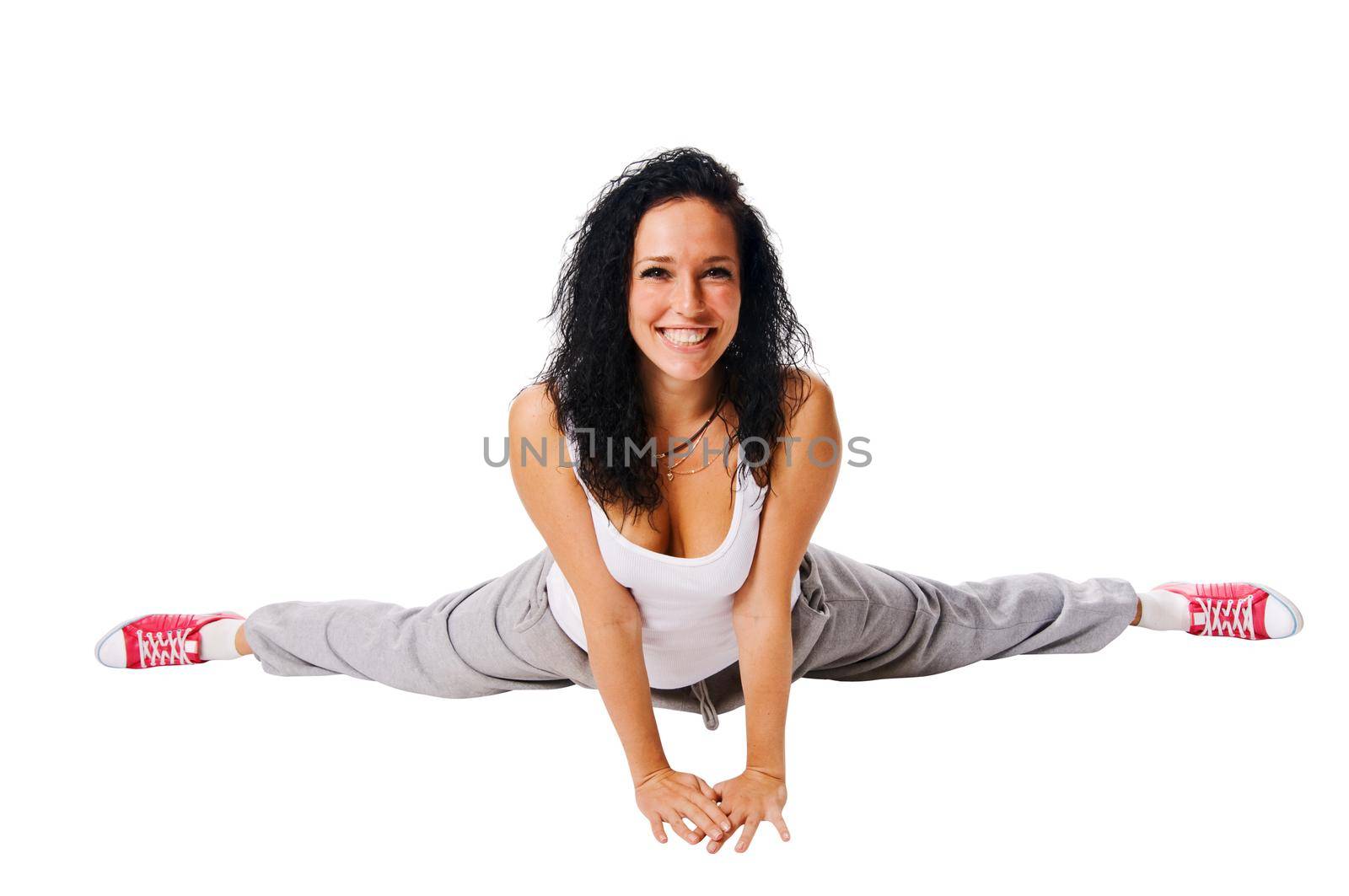 Beautiful dancer stretching isolated on white background