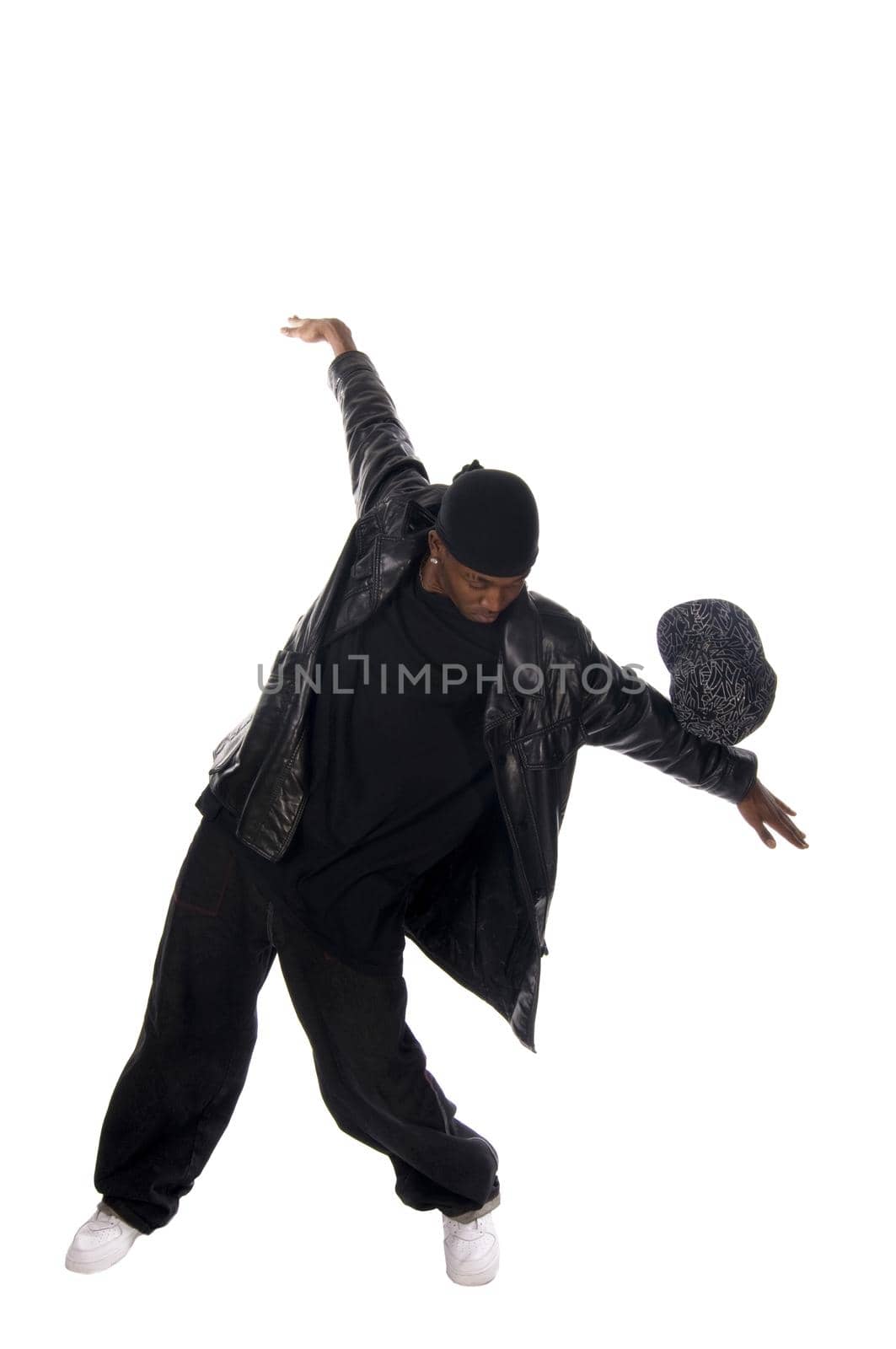 Cool young hip-hop dancer on white background