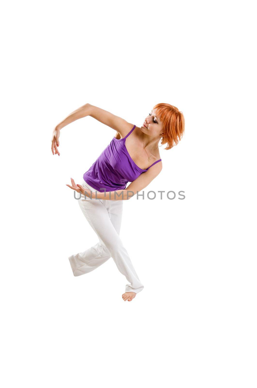 Red haired girl performing fitness exercises on white background