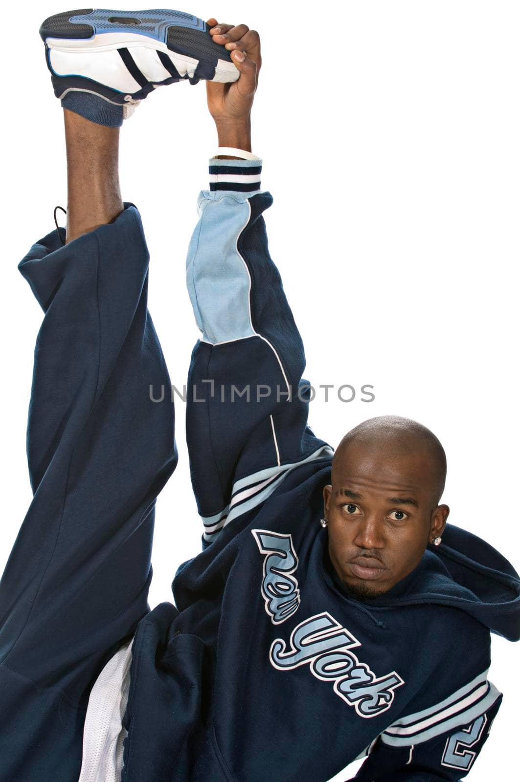 Cool young hip-hop dancer on white background