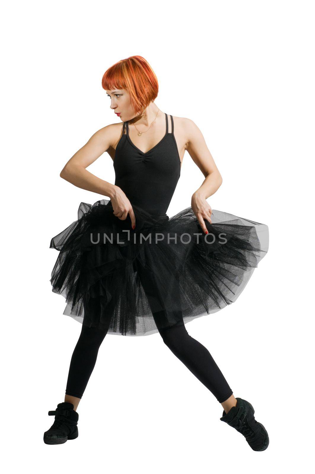 Beautiful red-haired ballerina wearing tutu on white background