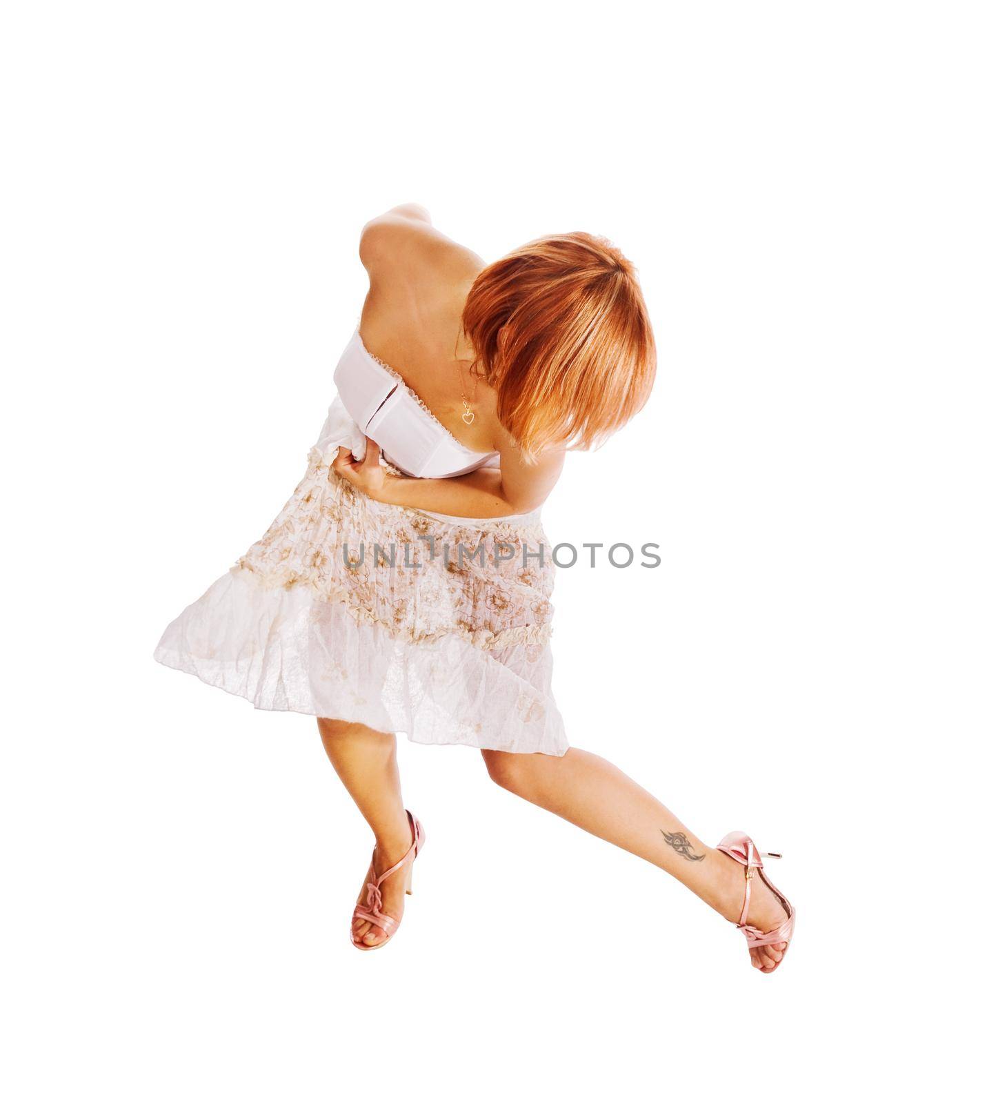 Beautiful red dancer isolated on white background