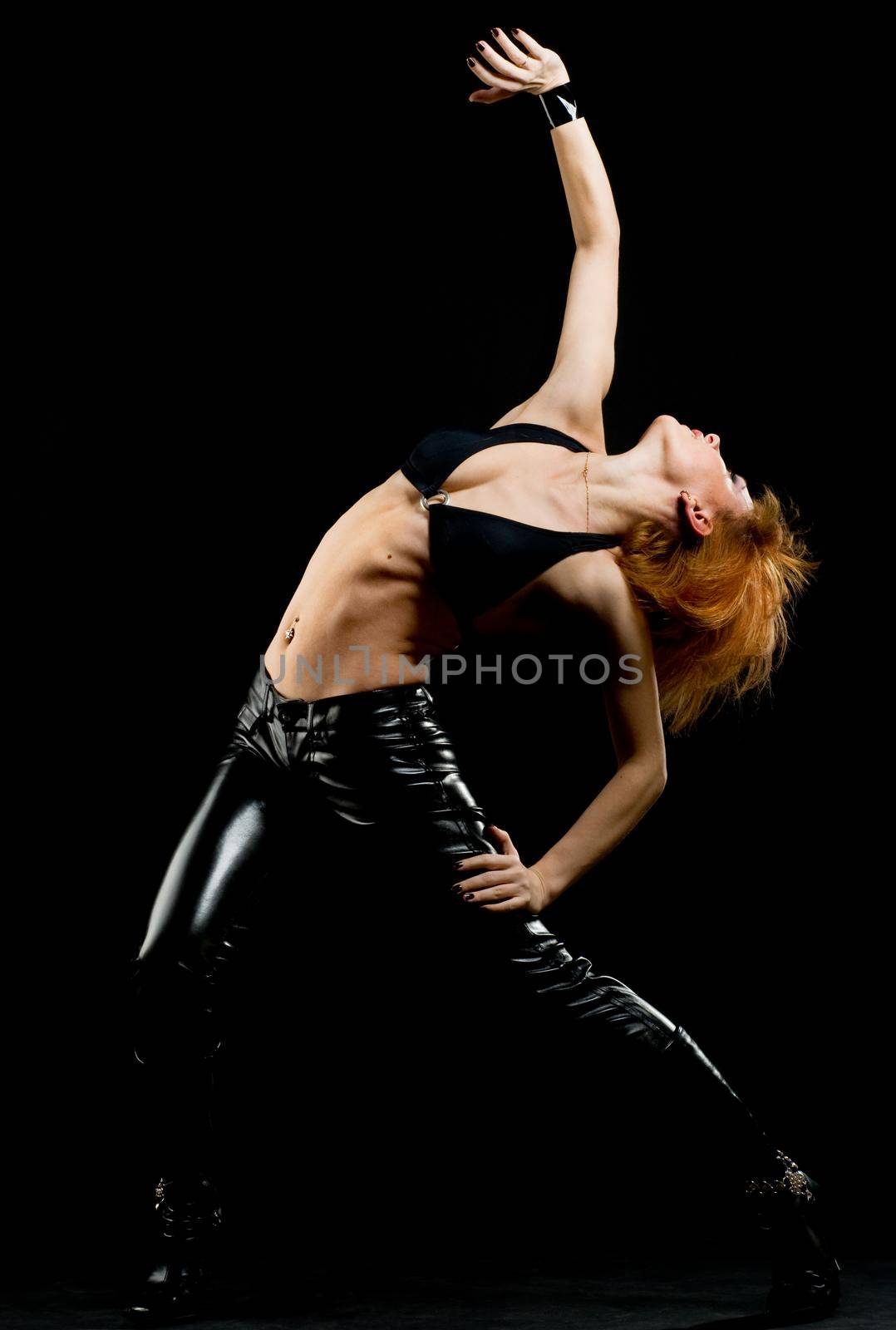 Studio shot of beautiful red girl on black background