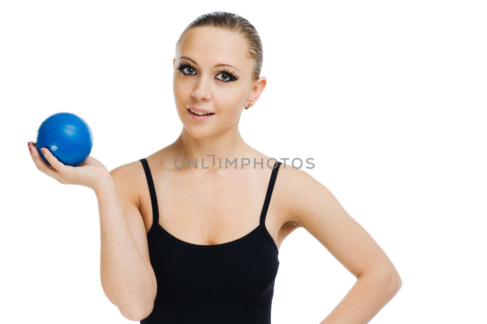 Beautiful fit red girl working out with blue ball