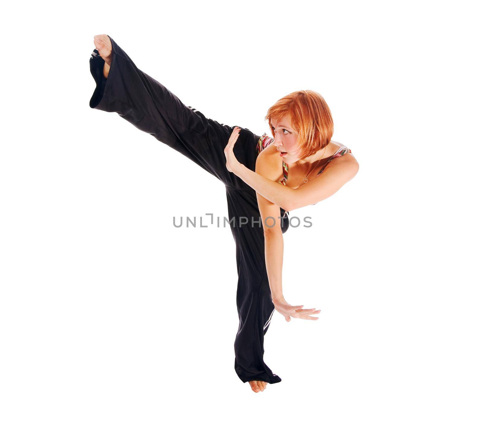 Sporty girl practicing matrial arts isolated on white