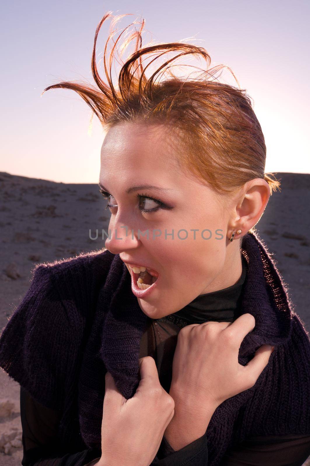 Beautiful red woman in the desert of Egypt