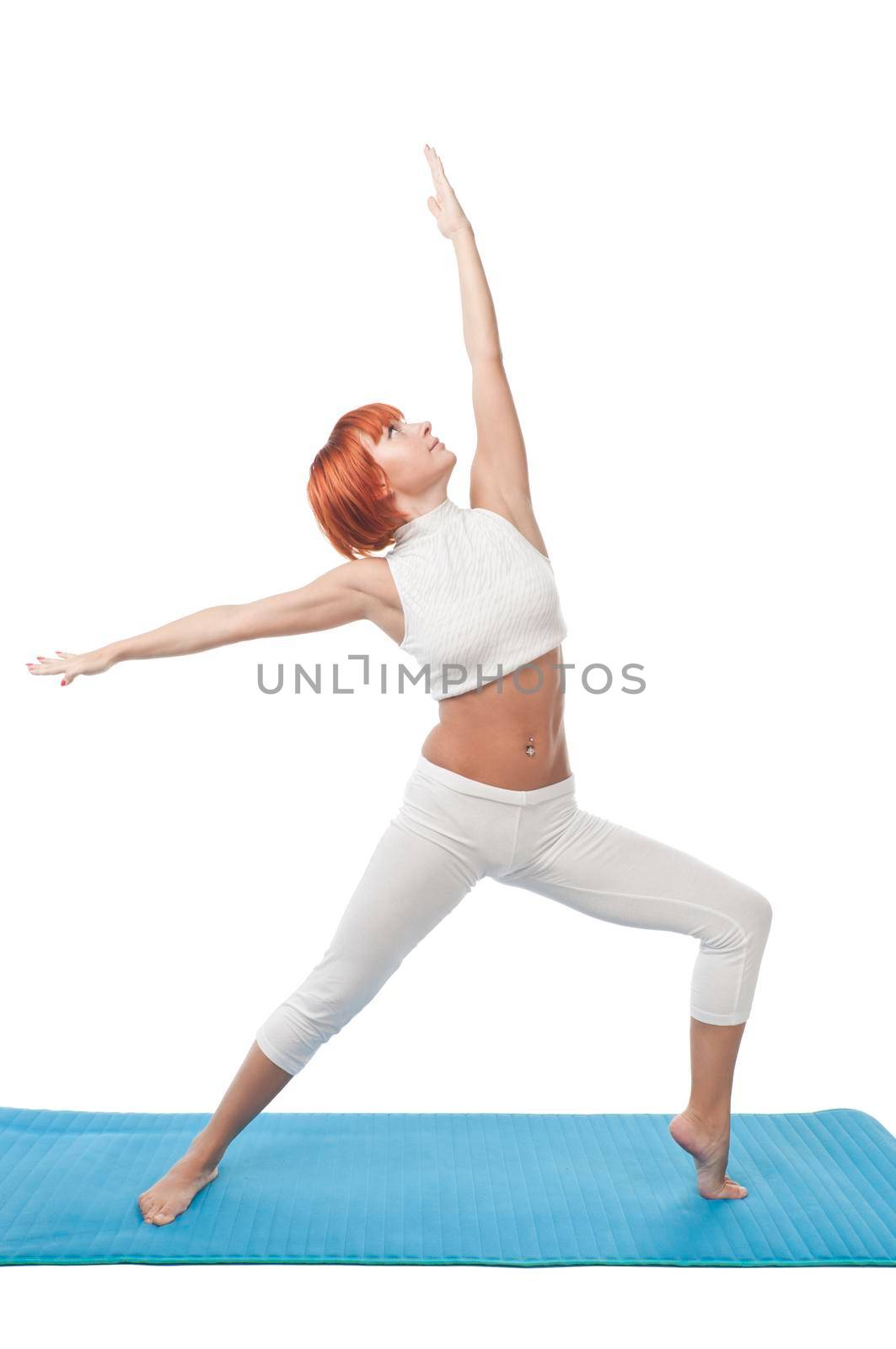 Beautiful girl practicing yogatic asana on yoga mat