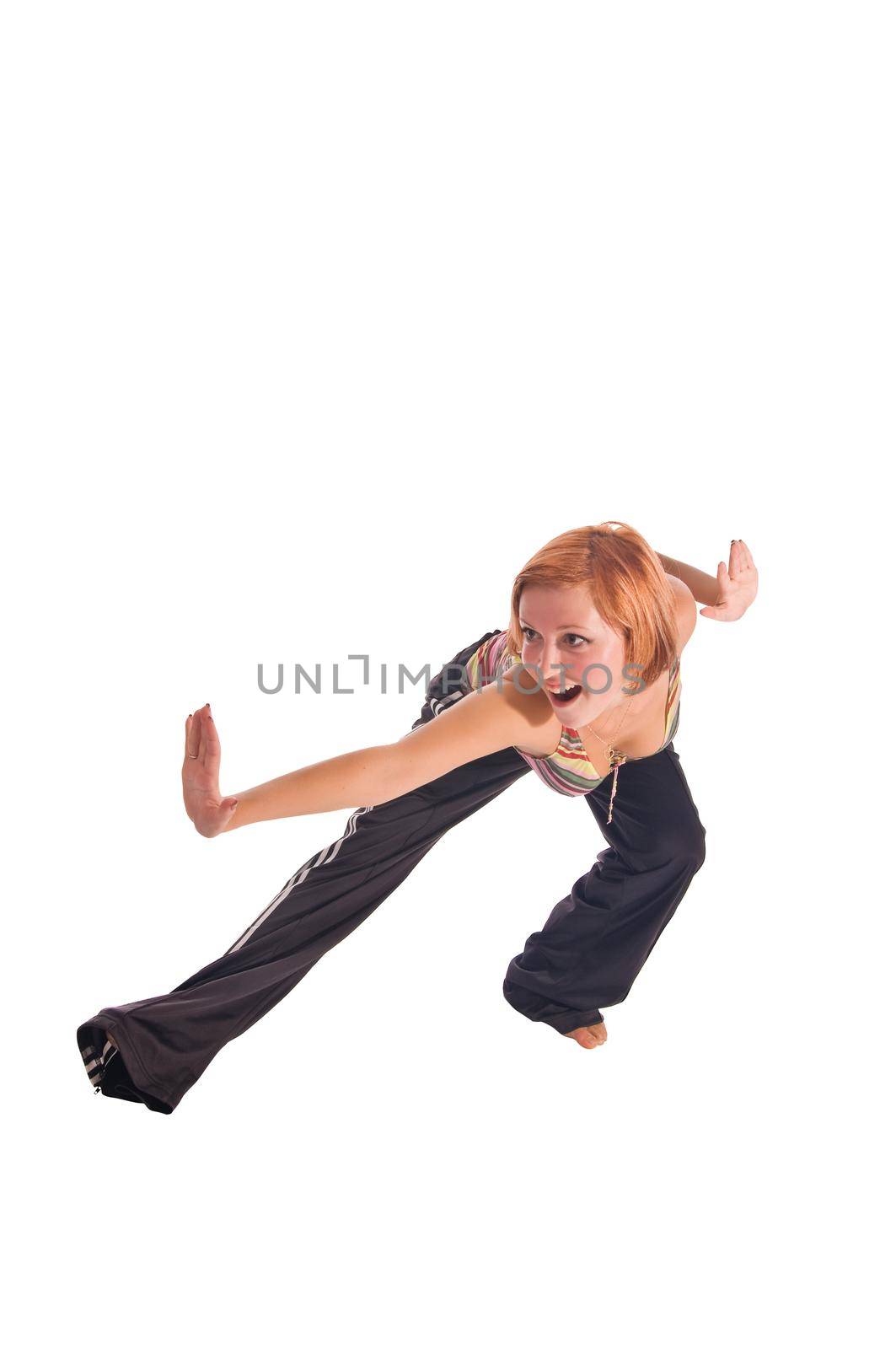 Red haired girl performing fitness exercises on white background