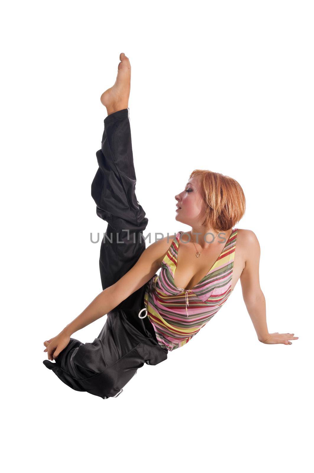 Red haired girl performing fitness exercises on white background