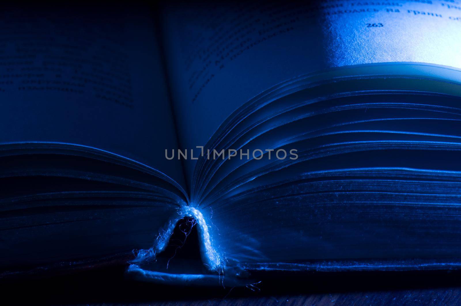 Old book in a cold blue light