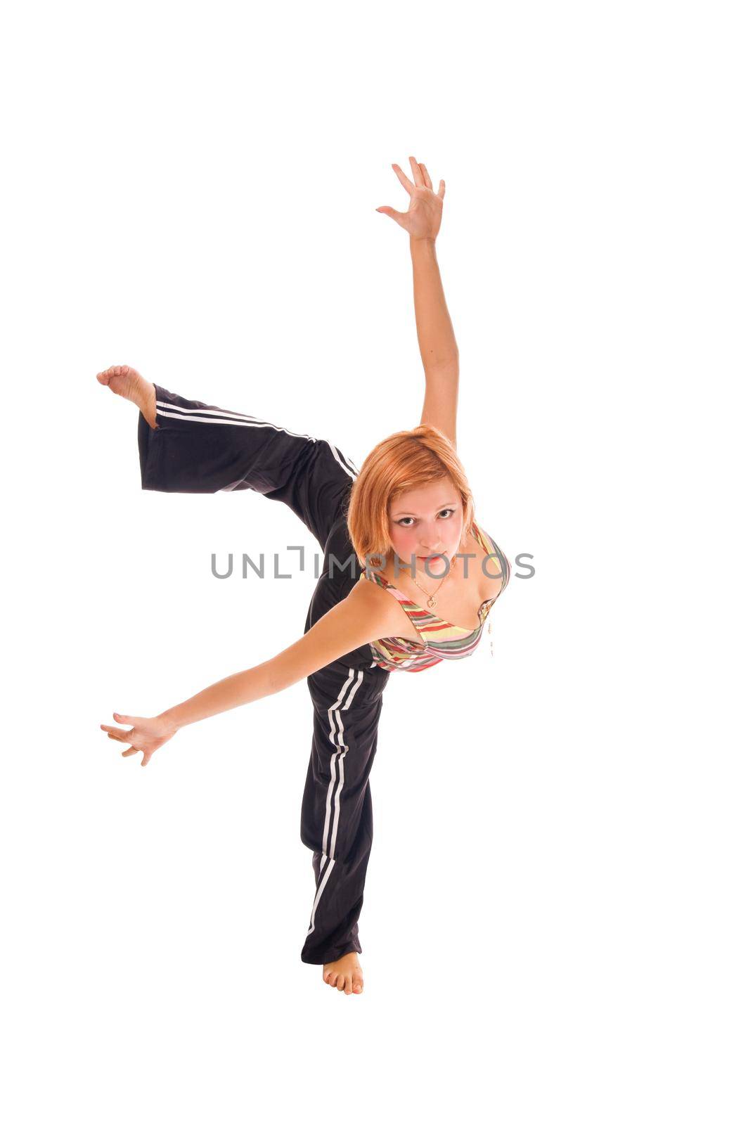 Red haired girl performing fitness exercises on white background