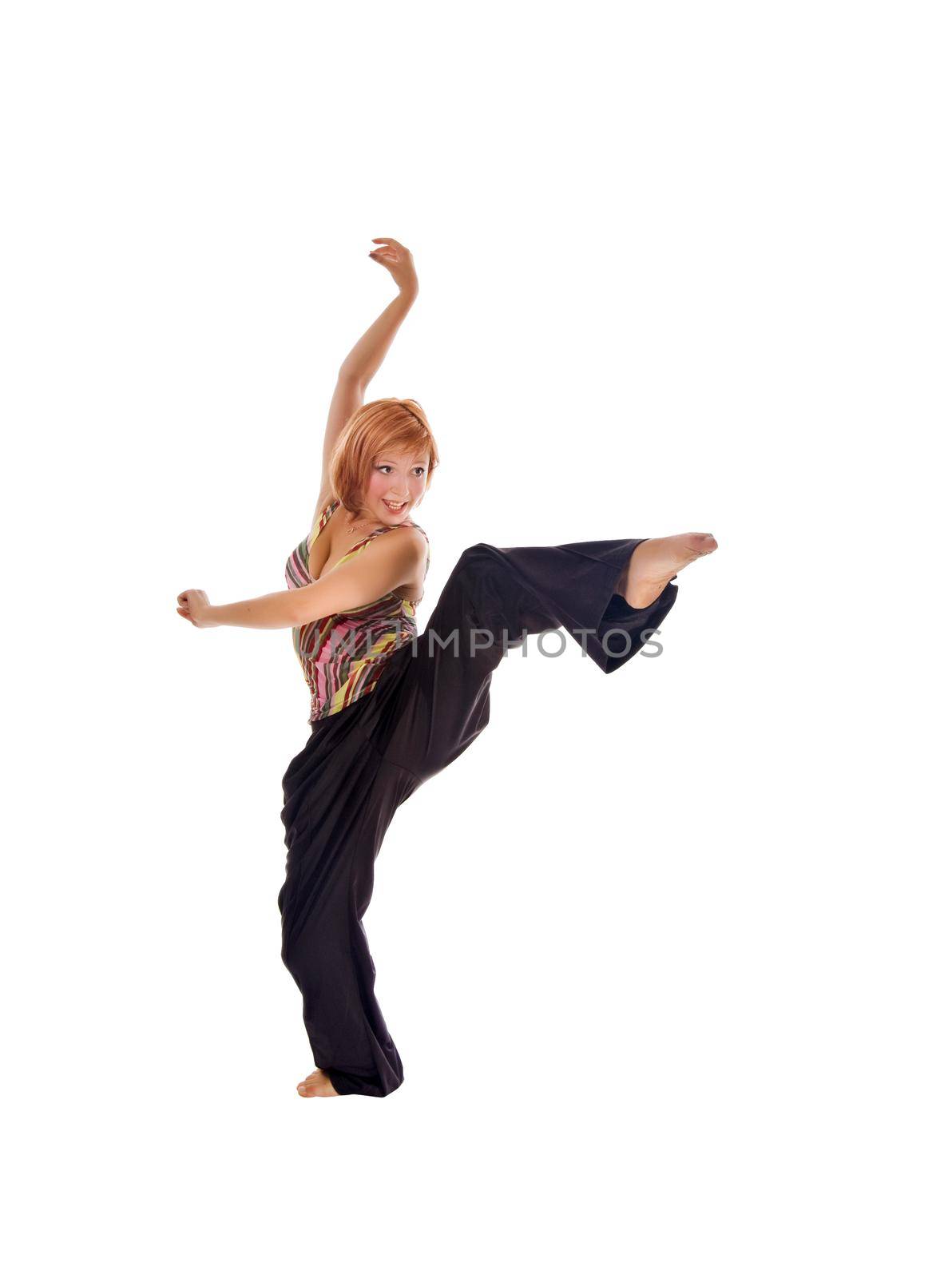 Red haired girl performing fitness exercises on white background