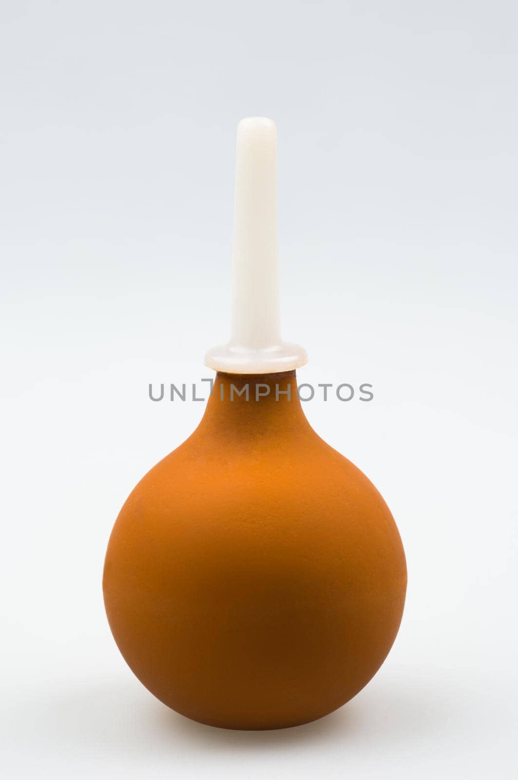 Enema (clyster) on white background with soft shadow