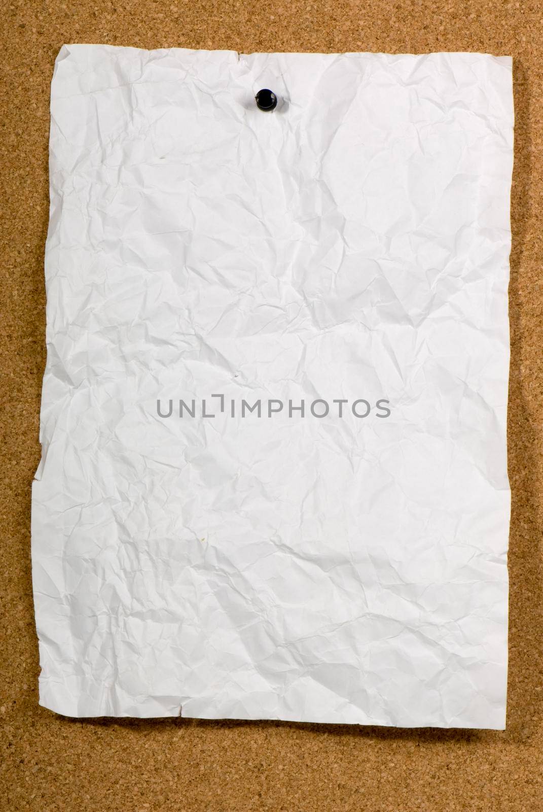 Page of old run-down paper attached to the bulletin board.