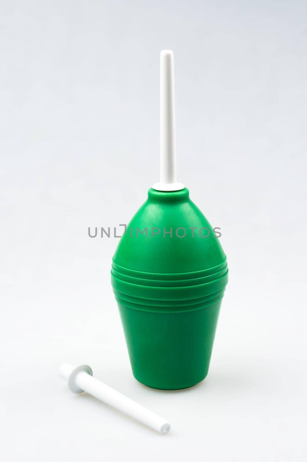 Enema (clyster) on white background with soft shadow