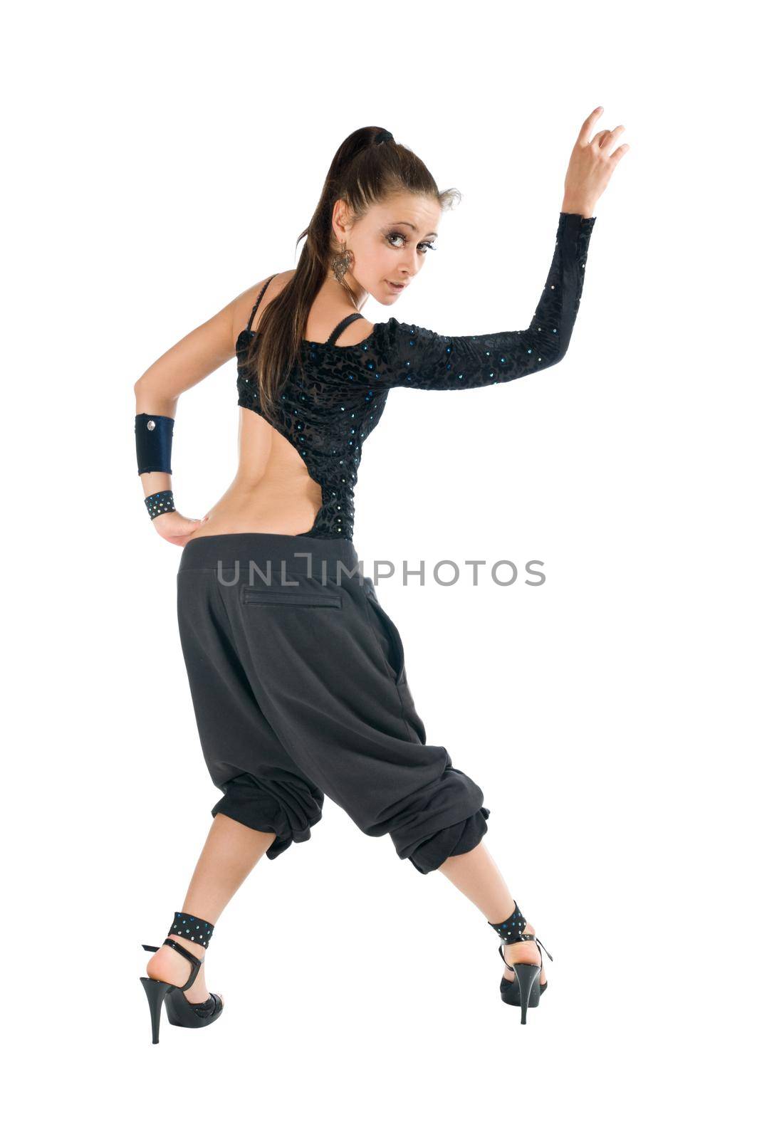 Beautiful young modern dancer performing on white background