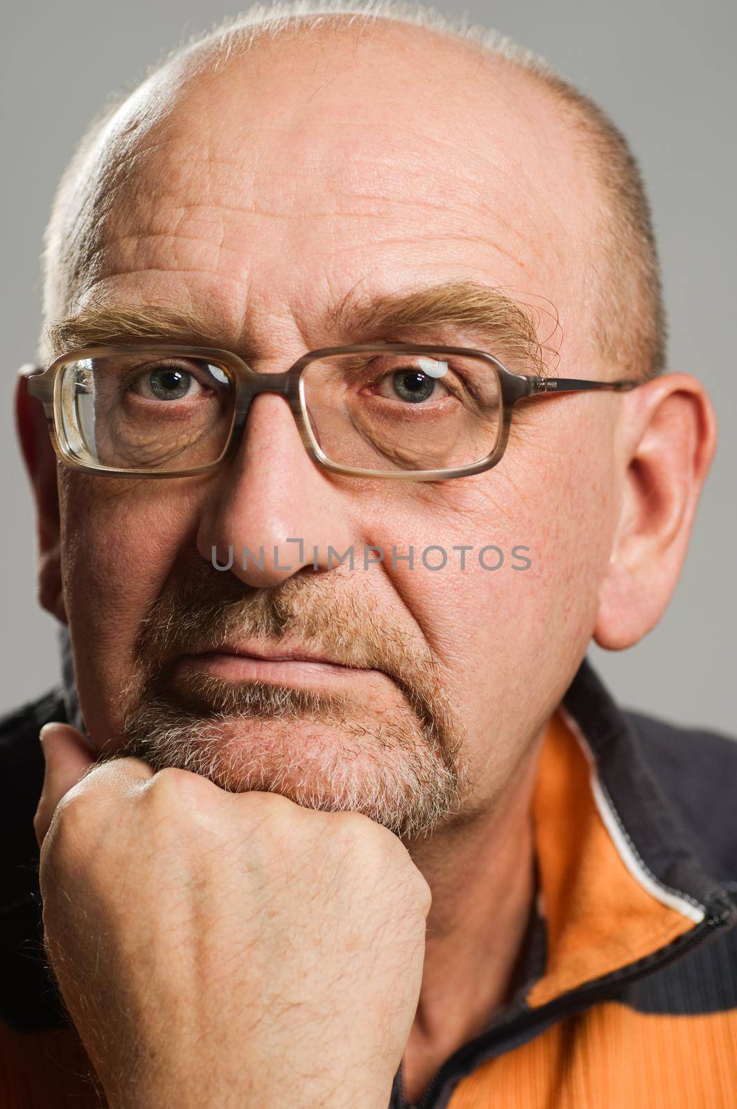 Handsome mature man posing on plain background