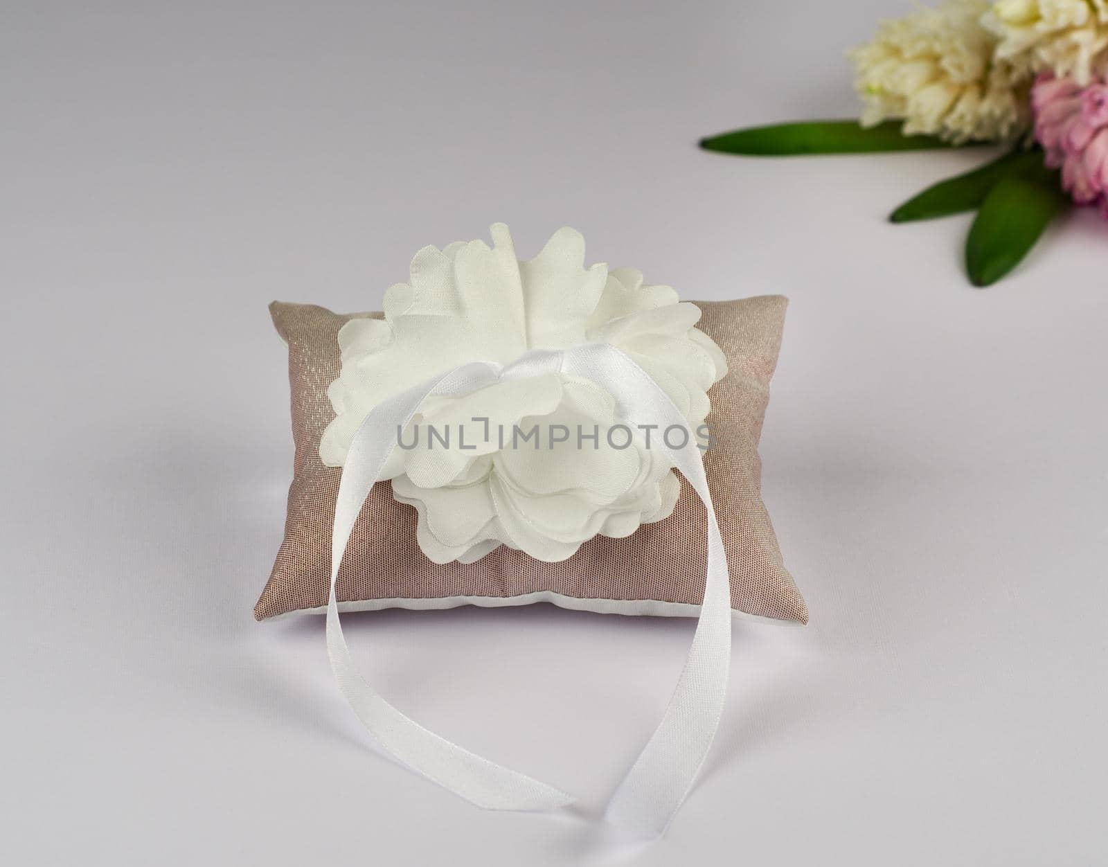 Brown pillow for wedding rings with flower by nikitabuida