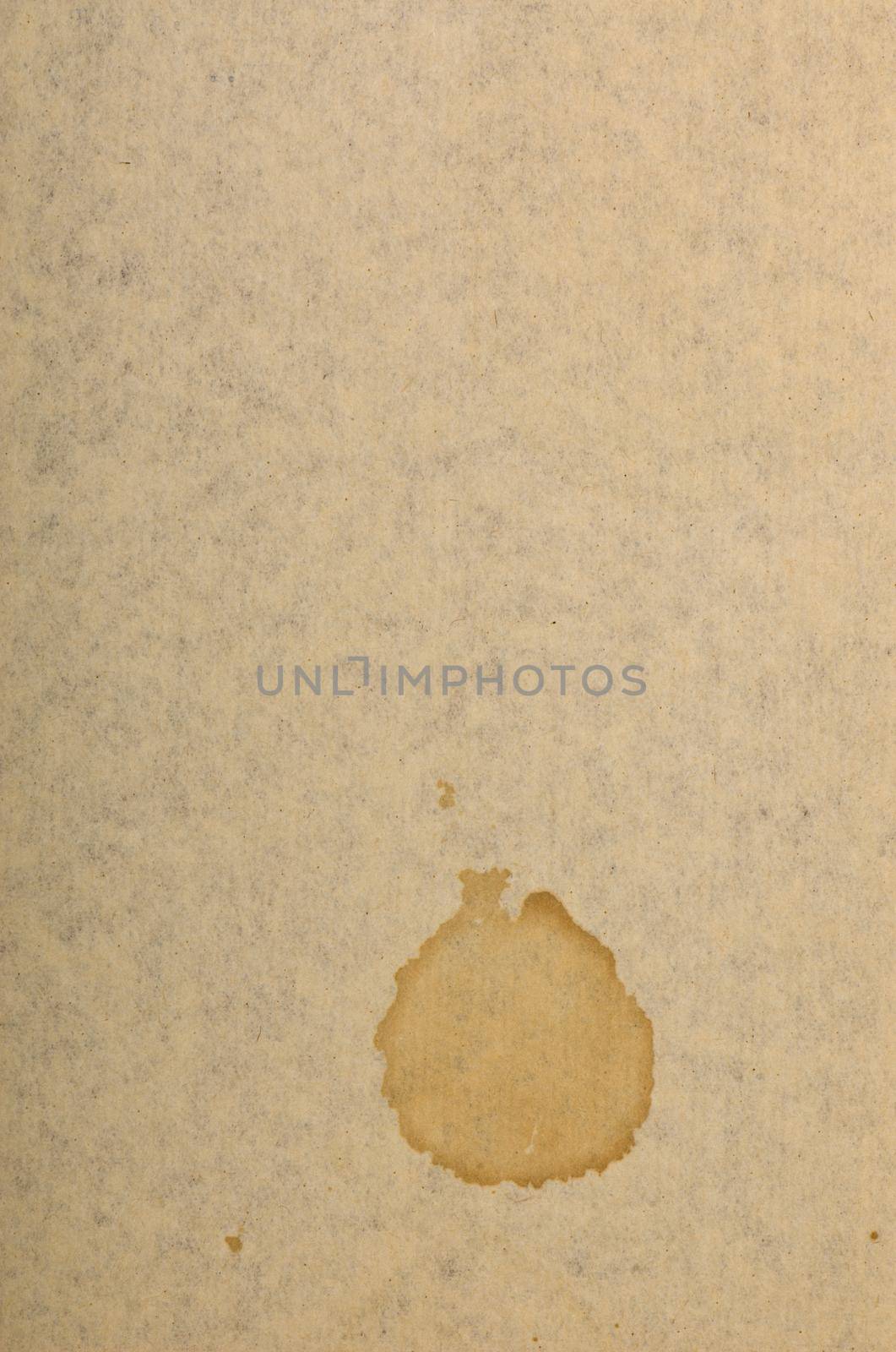 Page of old run-down paper with a stain