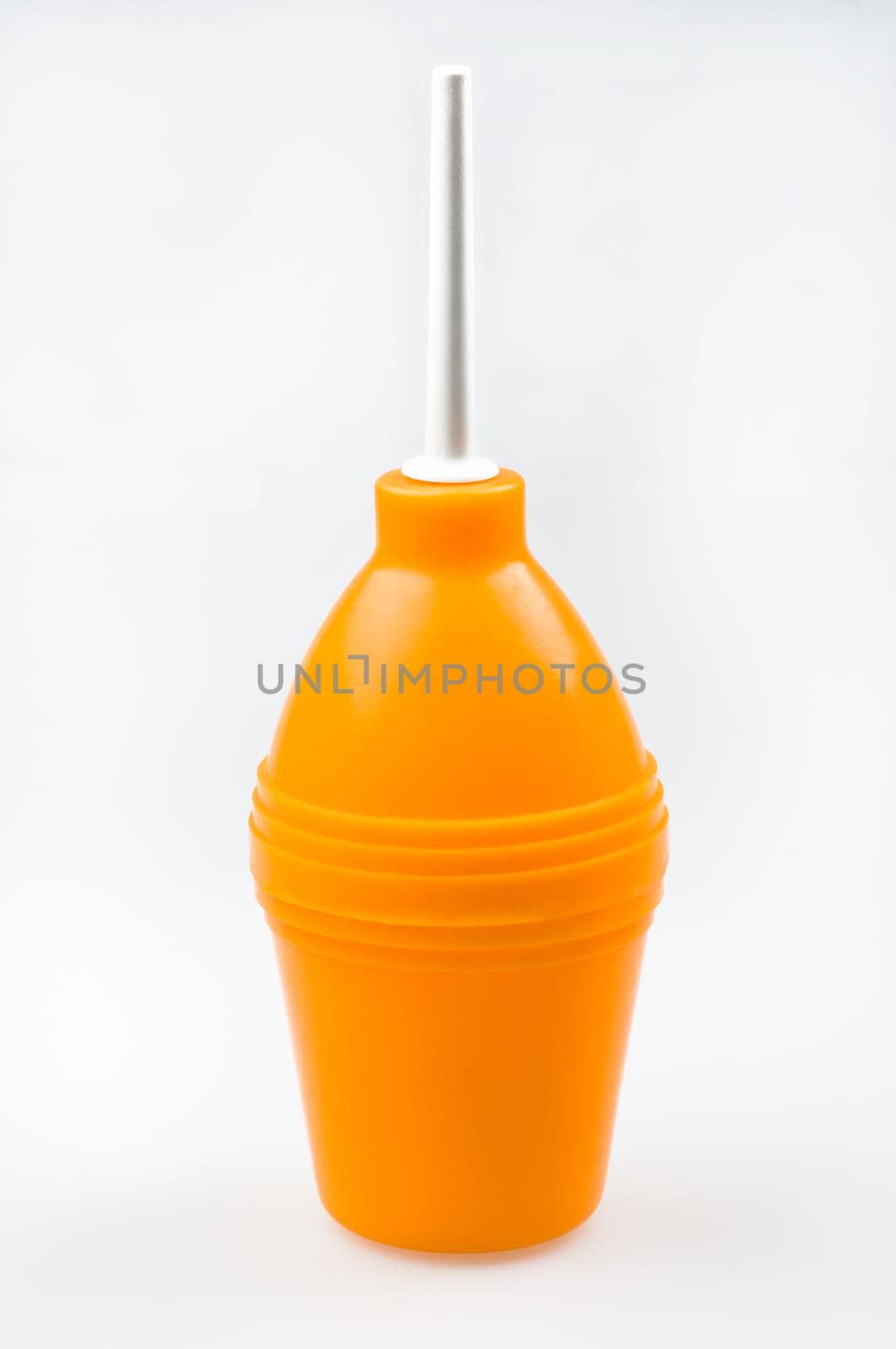Enema (clyster) on white background with soft shadow