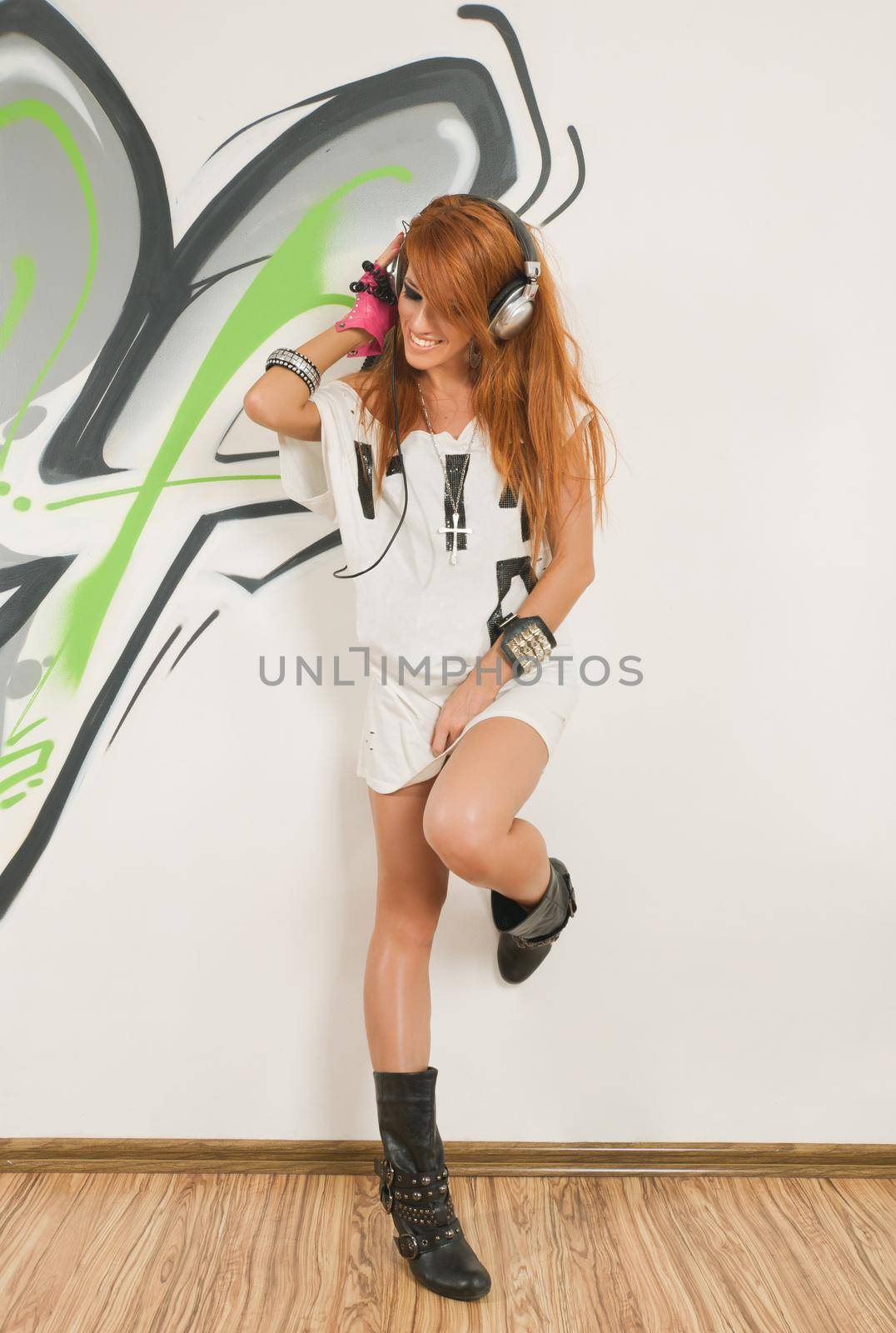 Red haired hip-hop dancer listening to the music