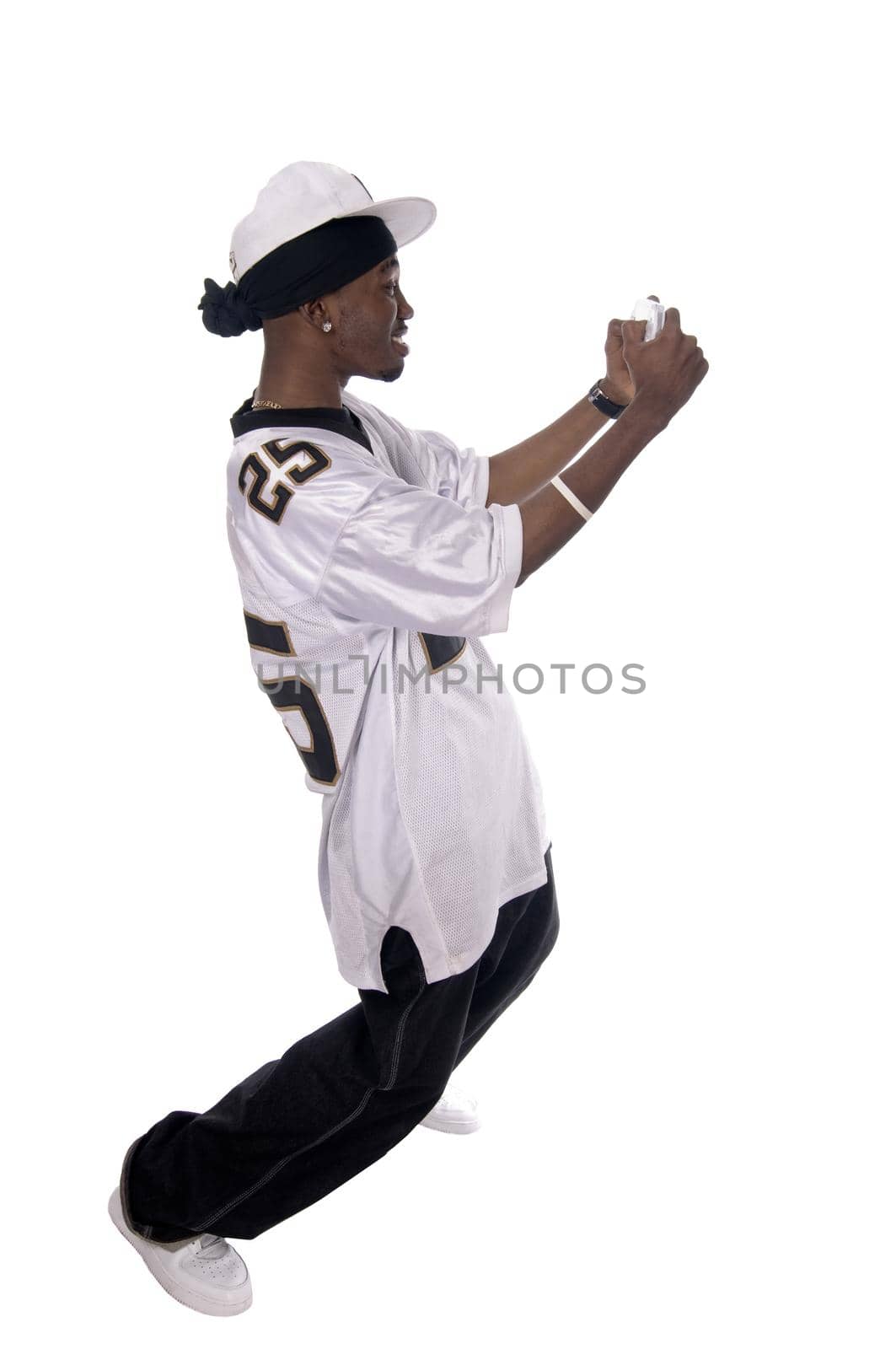Cool young hip-hop dancer on white background