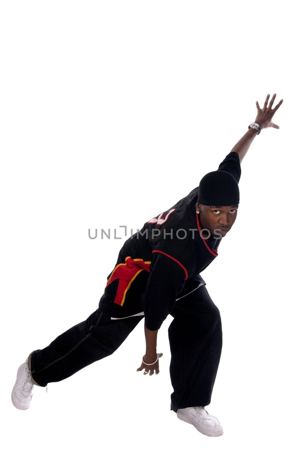 Cool young hip-hop dancer on white background