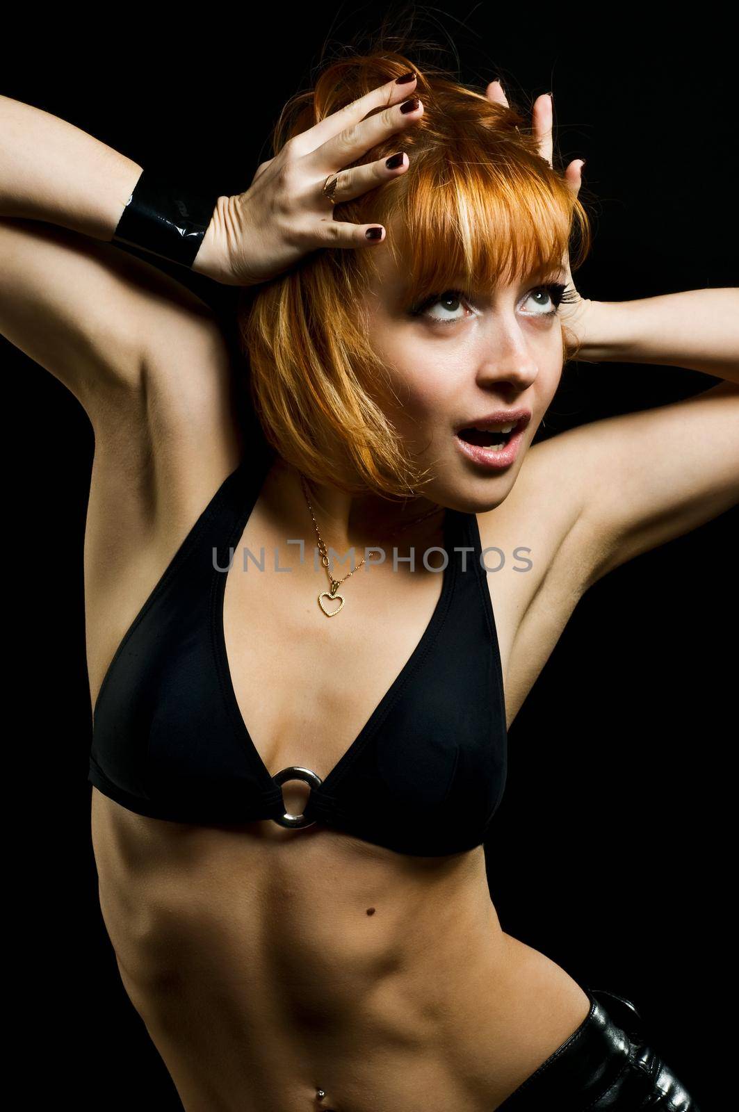 Studio shot of beautiful fit girl on black background